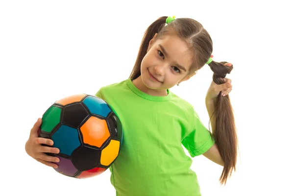 Young schoolgirl with multicolor soccer ball in hands — Stock Photo, Image