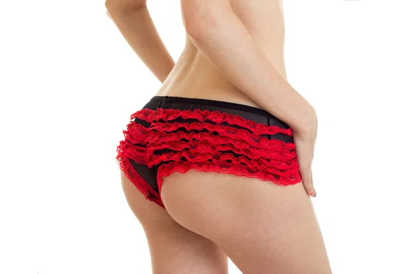 Primer plano de mujeres hermosas nalgas redondas en rojo con bragas negras — Foto de Stock