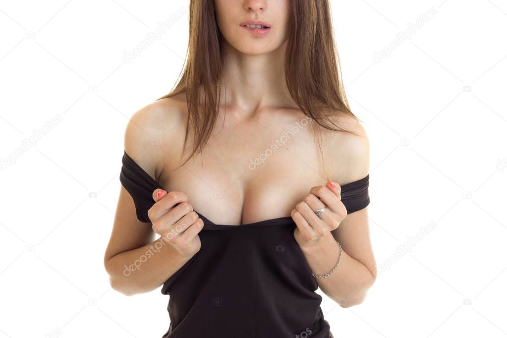woman bite a lips and take off a shirt to shows a big silicon breasts