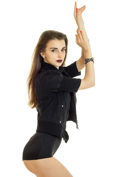 Beautiful young girl in a dark suit and with lipstick poses in the Studio — Stock Photo, Image