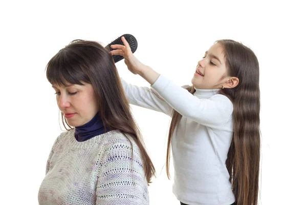 Little girl cobs a hair of her mother — Stock Photo, Image
