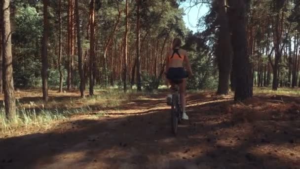 Beauty young girl driving a bik — Stock Video