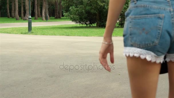 Young girl in shorts rollerblading — Stock Video