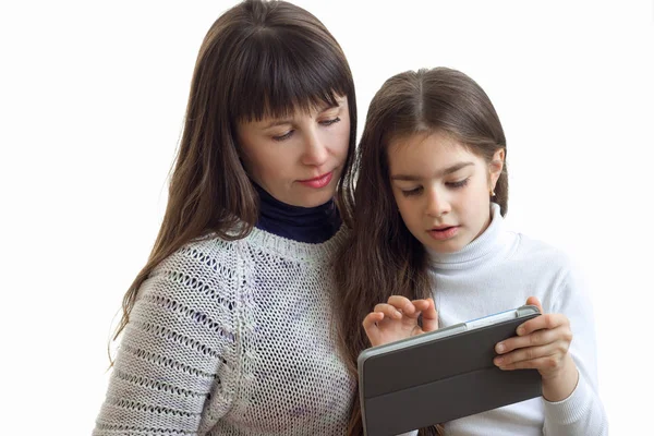 Little girl shows to her mother pictures on the internet tablet — Stock Photo, Image