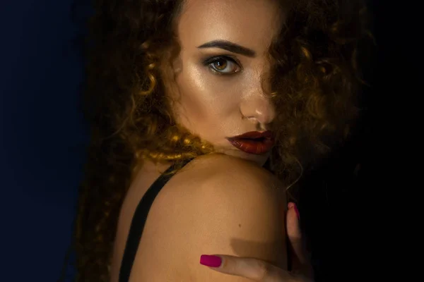 Young beautiful lady with curly hair and make up posing on camera — Stock Photo, Image
