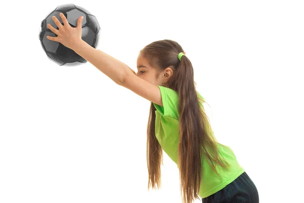 Little girl in sports uniform playing with soccer ball — Stock Photo, Image