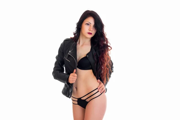 Cute young brunette woman in lingerie and leather jacket looking aside — Stock Photo, Image