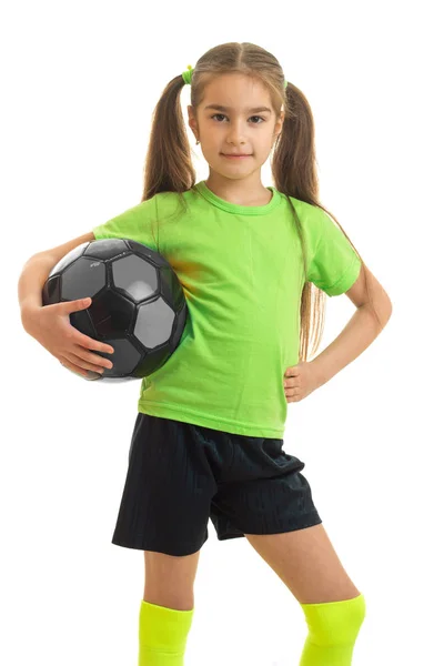 Charming young girl in green shirt with ball in hands — Stock Photo, Image