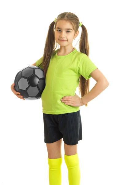 Vertical portrait of beautiful young girl with soccer ball in hands — Stock Photo, Image