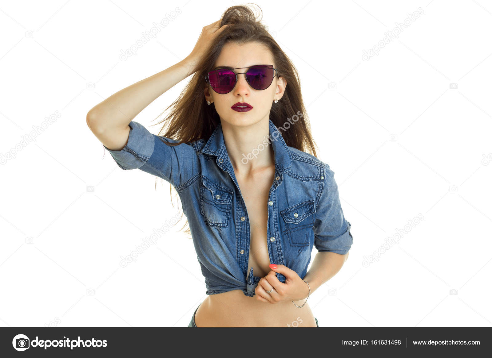 Sexy young girl in jeans shirt and sunglasses without bra Stock Photo by  ©ponomarencko 161631498