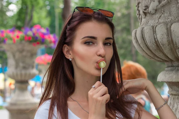 A close-up portrait of young sexual woman with lollipop — Stock Photo, Image