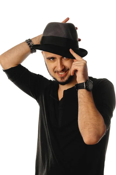 Cheerful macho man in hat looking away and smiling — Stock Photo, Image