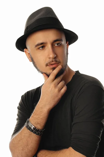 Vertical portrait of handsome unshaved macho man in hat looking — Stock Photo, Image