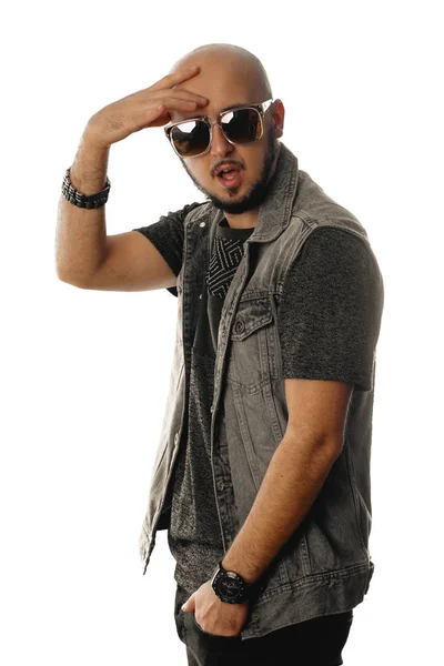 Sexy young unshaved macho in sunglasses posing on camera Stock Image