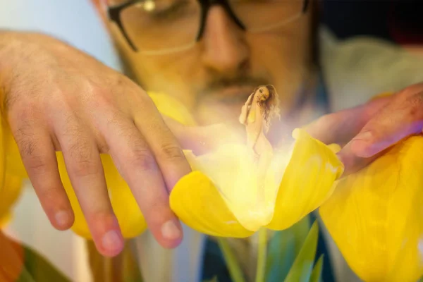 Handsome young scientist in glasses grew a sexy girl in flower — Stock Photo, Image