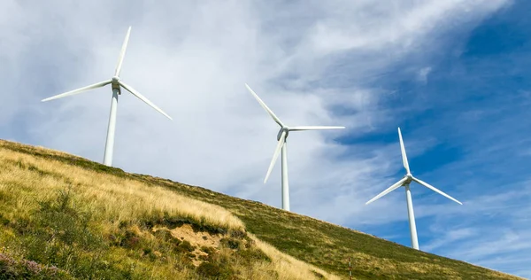 Wind turbines in top of a hill — Stock Photo, Image