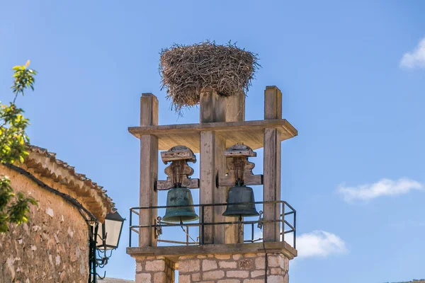 Bell tower with stork nest — Stockfoto