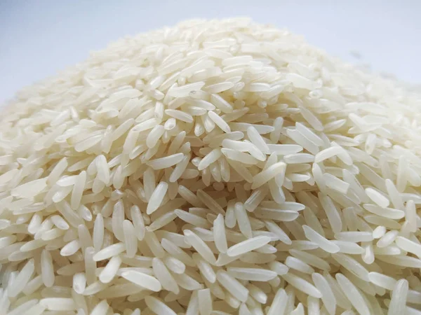 Jasmine rice on white background , close up — Stock Photo, Image