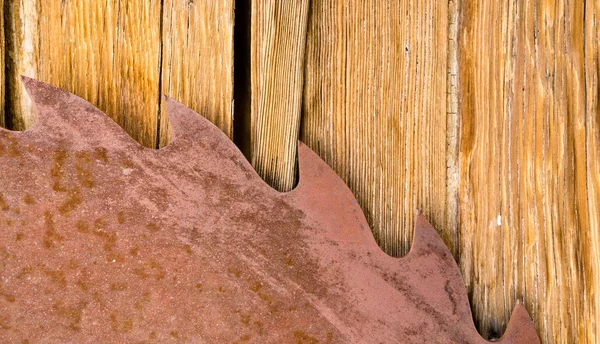 Rusty Sawblade Against Wood it Was Designed to Cut — Stock Photo, Image