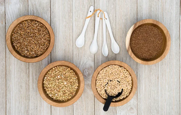 Whole Grains Superfoods Portioned in Ramekins on Wood table — Stock Photo, Image