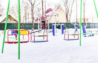 Swing on playground in winter