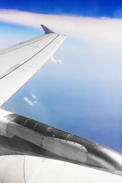 Stock image Wing of plane in clouds