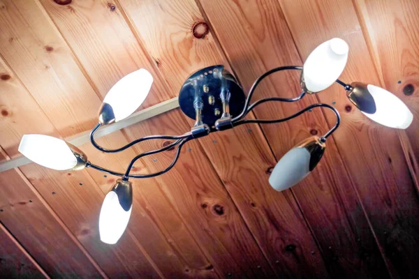 Lamp under wooden ceiling — Stock Photo, Image