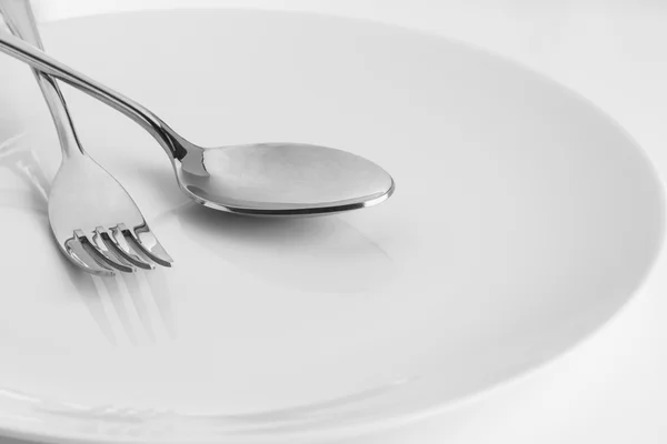 Fork and Spoon in plate — Stock Photo, Image