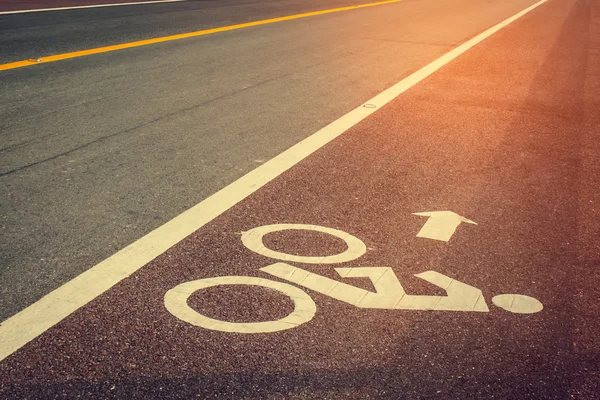 Bicycle sign on bike  lane in asphalt road — Stock Photo, Image