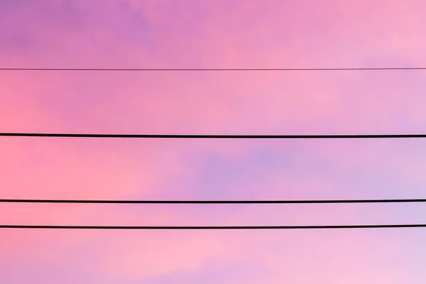 Electric wire with colorful sky at sunset — Stock Photo, Image