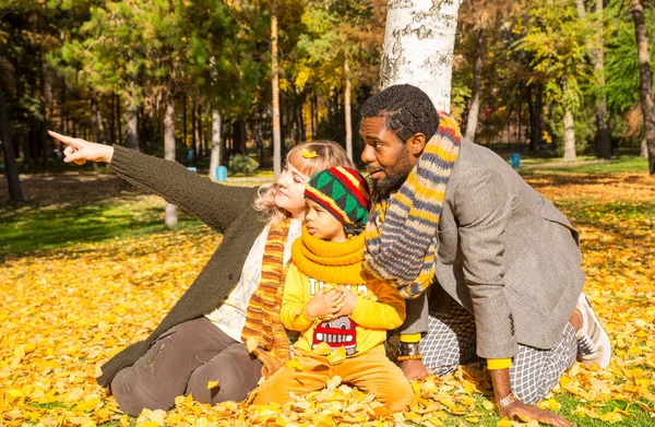 Happy family in autumn park. African American family: black father, mom and child boy on nature in fall. — Stock Photo, Image