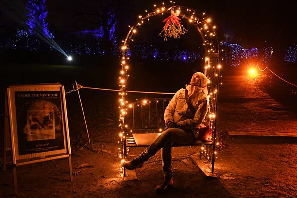 Woman sitting on bench in the park