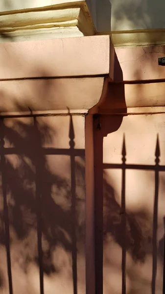 Blurry Shadows Tree Foliage Striped Shadows Antique Ornate Metal Fence — ストック写真