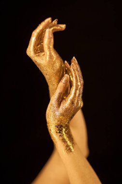 Beautiful woman hands gold, golden hands, glitter posing like ballet dancer, sensual studio shot clipart