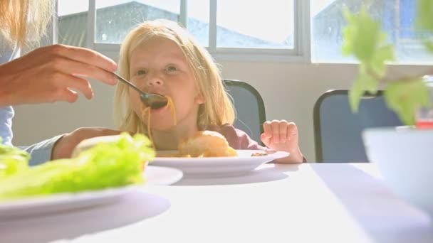 Little girl having breakfast — Stock Video