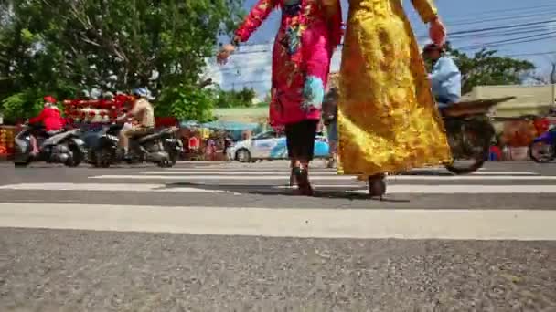 Girls in long dresses cross street crossroad — Stock Video