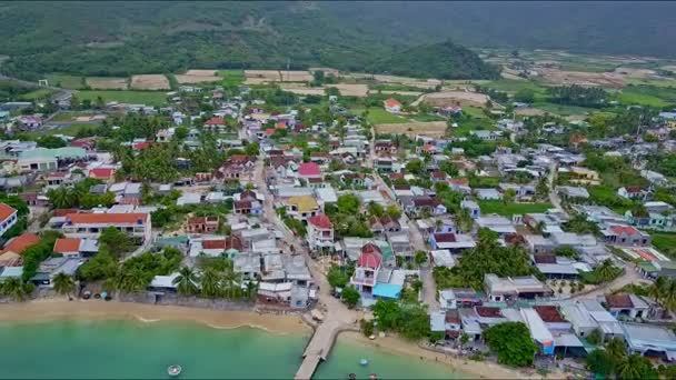 Town with houses and bay with fishing boats — Stock Video