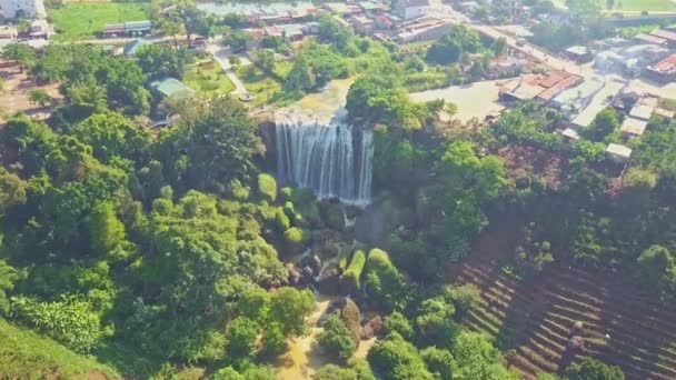 Waterfall running among tropical park — Stock Video