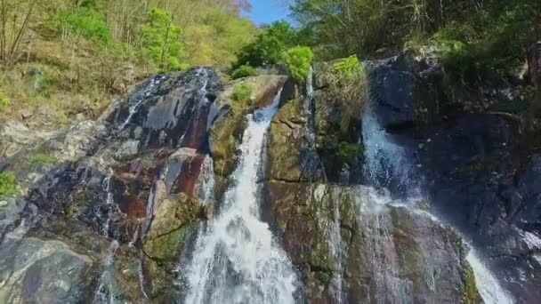 Waterfall between steep rocky slopes — Stock Video