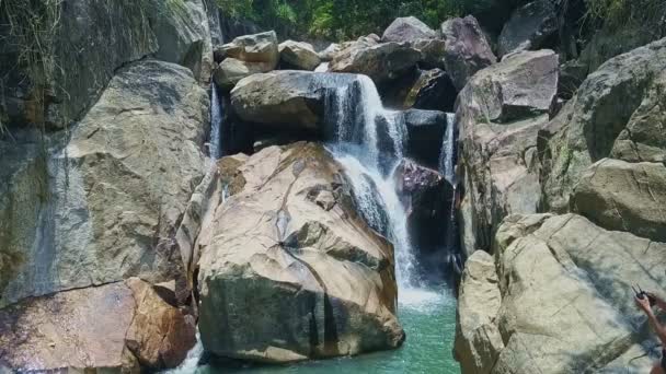 River waterfall cascades among huge rocks — Stock Video