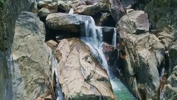 River waterfall cascades among huge rocks — Stock Video