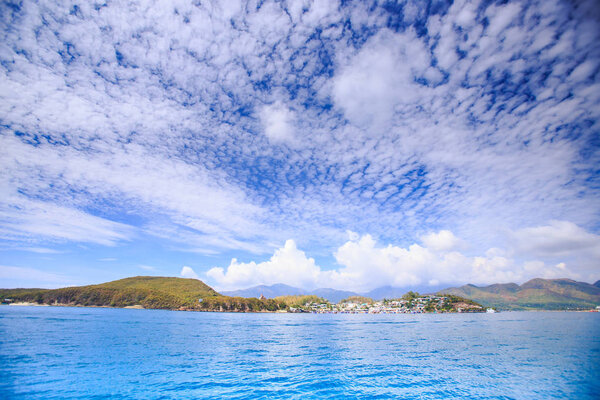 Clouds Lace in Sky above Sea 