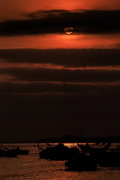 Dark Fishing Boat Silhouettes Ocean Sun Disk Appear Clouds Sunset — Stock Photo, Image