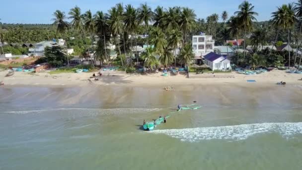 Upper View Asian Fishermen Haul Blue Boat Net Ocean Beach — Stock Video