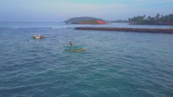 Fishermen sail on boats along sea near pier bird eye view — 비디오