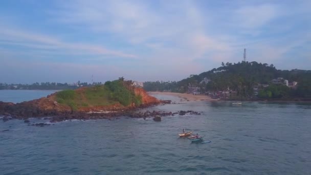 Fishermen sail on wooden boats along ocean upper — 비디오