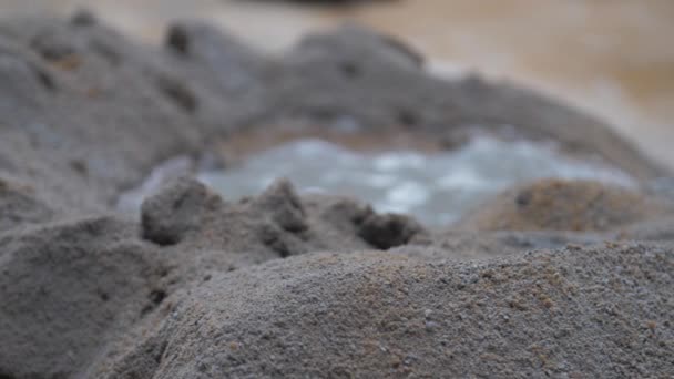 Person mixes cement and water moving with metal shovel — Stock Video