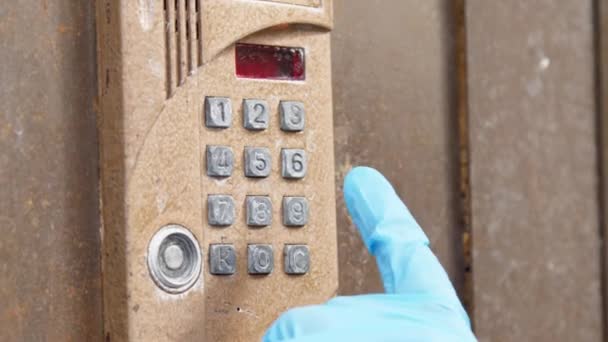 Person in blue sterile glove presses buzzer buttons — Stock Video