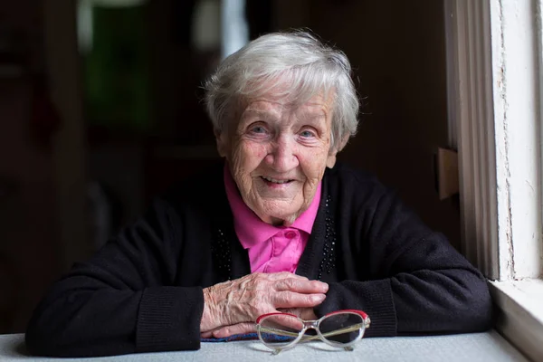 Old woman at home — Stock Photo, Image