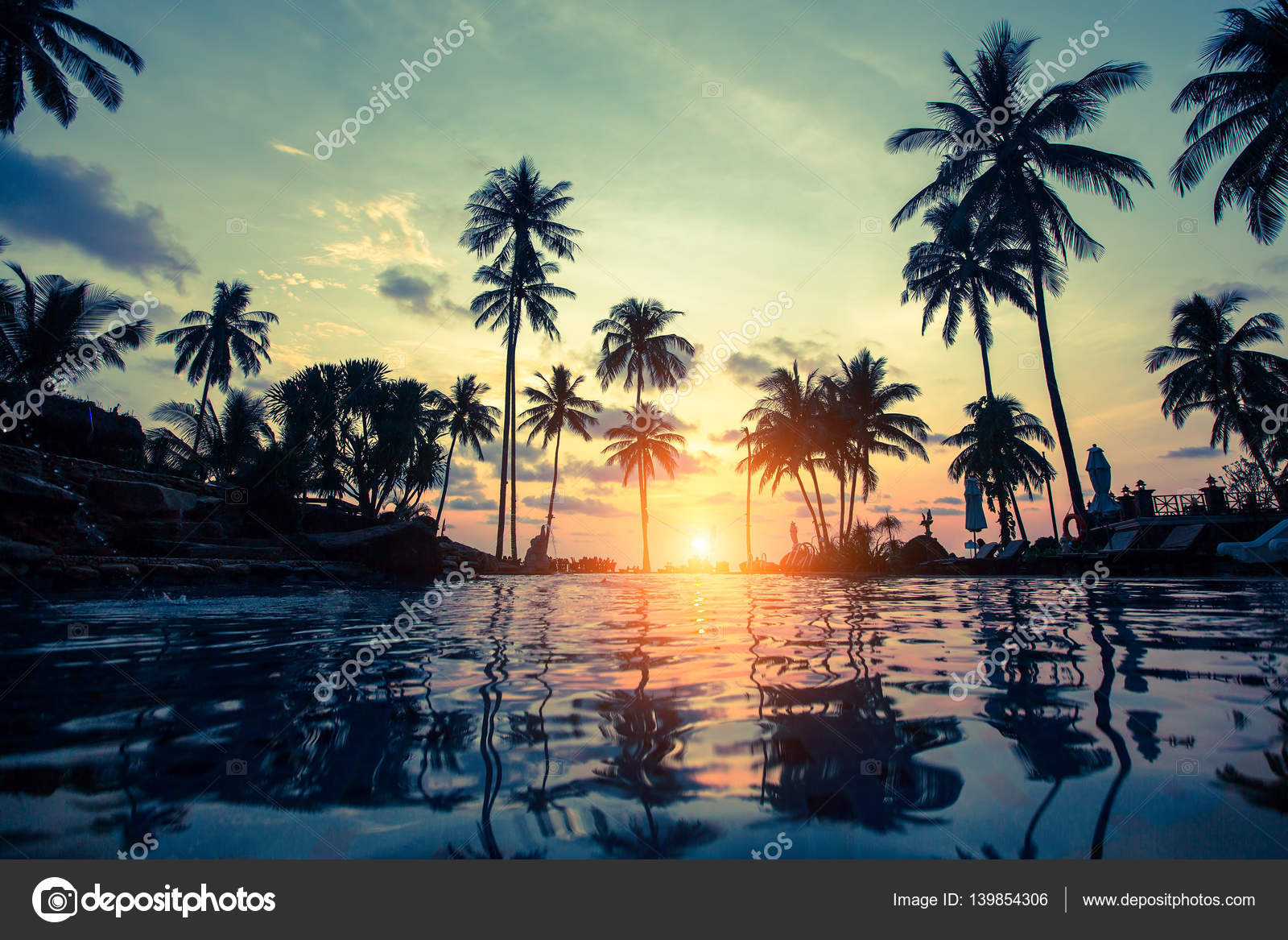 Beautiful sunset on tropical beach Stock Photo by ©dimaberkut 139854306